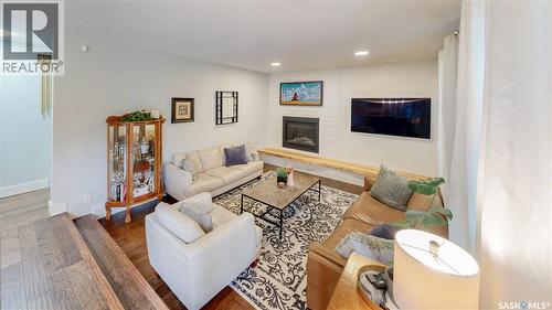 7551 Butler Bay, Regina, SK - Indoor Photo Showing Living Room With Fireplace