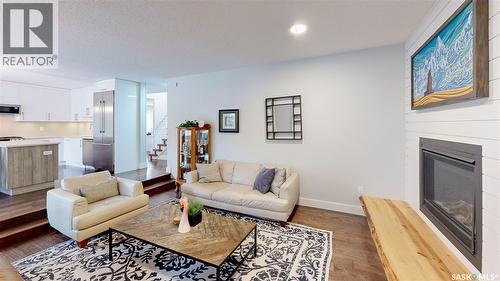 7551 Butler Bay, Regina, SK - Indoor Photo Showing Living Room With Fireplace