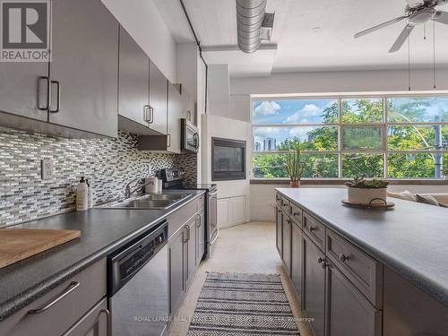 207 - 365 Dundas Street E, Toronto, ON - Indoor Photo Showing Kitchen With Double Sink