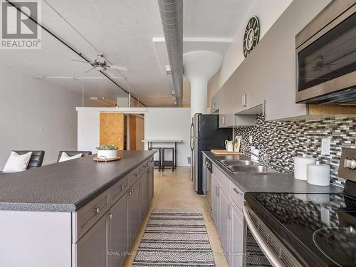 207 - 365 Dundas Street E, Toronto, ON - Indoor Photo Showing Kitchen With Double Sink
