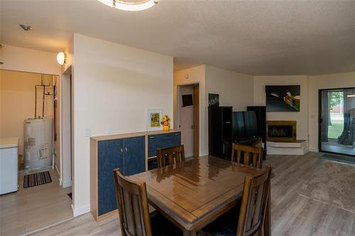 105-693 A St Anne'S Rd, Winnipeg, MB - Indoor Photo Showing Dining Room With Fireplace