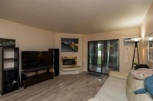 105-693 A St Anne'S Rd, Winnipeg, MB - Indoor Photo Showing Living Room With Fireplace