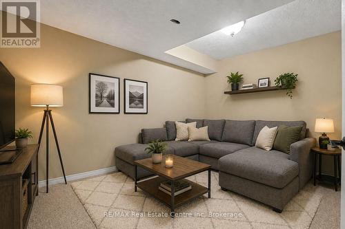 Virtually staged den in basement - 115 Mcfarlane Drive, Cambridge, ON - Indoor Photo Showing Living Room