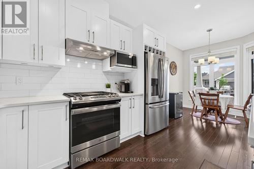 Under Valance Lighting + Subway Tile Backsplash - 224 Maygrass Way, Ottawa, ON - Indoor Photo Showing Kitchen With Upgraded Kitchen