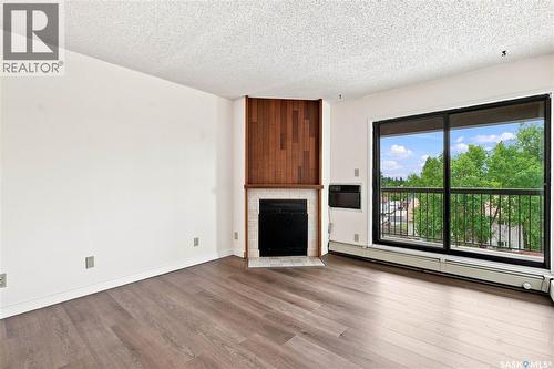 302 345 Kingsmere Boulevard, Saskatoon, SK - Indoor Photo Showing Other Room With Fireplace