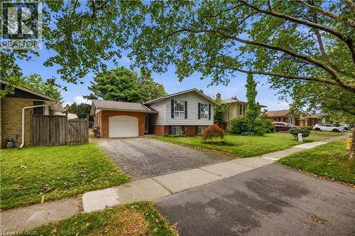 Split-level residence featuring a brick and siding exterior, an attached single-car garage, and a paved driveway - 11 Kimbermount Drive, St. Catharines, ON - Outdoor With Facade