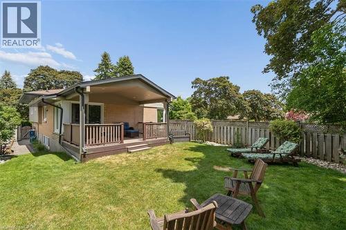 Covered rear deck and private yard that is fully fenced. - 138 Blueridge Avenue, Kitchener, ON 