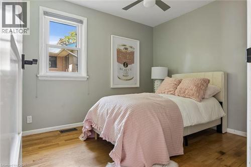 Hardwood flooring, a single window, ceiling fan, and painted walls - 90 Dean Avenue, Guelph, ON - Indoor Photo Showing Bedroom