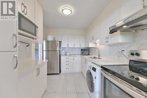 #1710 - 11 Wincott Drive, Toronto, ON - Indoor Photo Showing Kitchen With Double Sink