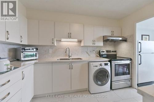 #1710 - 11 Wincott Drive, Toronto, ON - Indoor Photo Showing Kitchen With Double Sink