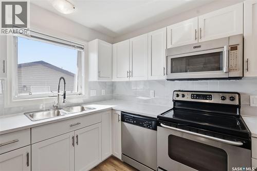 738 Lamarsh Lane, Saskatoon, SK - Indoor Photo Showing Kitchen With Double Sink