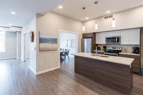 304-50 Philip Lee Dr, Winnipeg, MB - Indoor Photo Showing Kitchen With Double Sink With Upgraded Kitchen