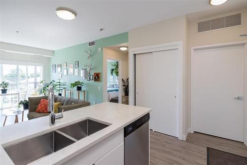 304-50 Philip Lee Dr, Winnipeg, MB - Indoor Photo Showing Kitchen With Double Sink