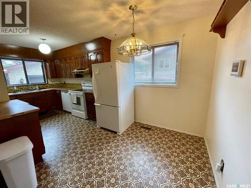 3118 7Th Avenue E, Regina, SK - Indoor Photo Showing Kitchen With Double Sink