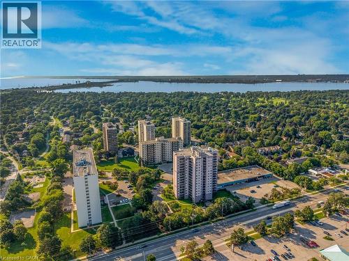 Aerial perspective showcasing multiple high-rise buildings and expansive green spaces - 975 Warwick Court Unit# 708, Burlington, ON - Outdoor With View
