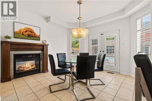 150 Davidson Boulevard, Dundas, ON - Indoor Photo Showing Dining Room With Fireplace