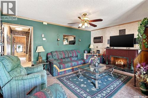 1229 Willow Avenue, Moose Jaw, SK - Indoor Photo Showing Living Room With Fireplace