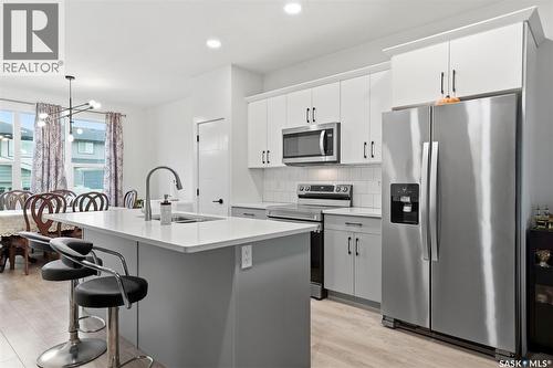 132 Rosewood Boulevard E, Saskatoon, SK - Indoor Photo Showing Kitchen With Stainless Steel Kitchen With Upgraded Kitchen