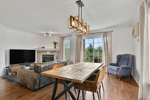 Salle à manger - 5-620 Rue Proulx, Mont-Tremblant, QC - Indoor Photo Showing Other Room With Fireplace