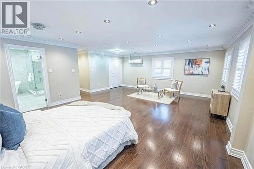 Spacious interior featuring dark wood-finish flooring, recessed lighting, crown molding, and white window shutters - 247 Sand Road, Holland Landing, ON - Indoor