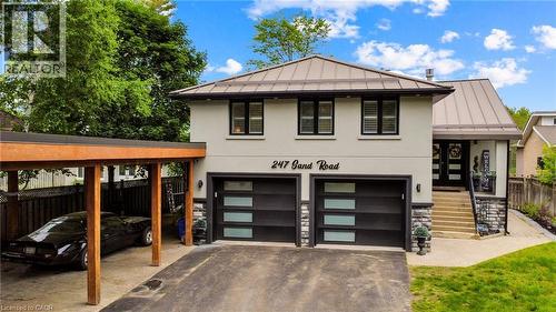 Contemporary stucco facade featuring a metal roof and an attached carport - 247 Sand Road, Holland Landing, ON - Outdoor