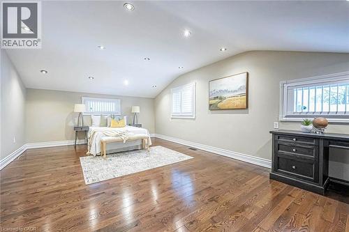 Spacious room featuring rich wood-finish flooring, recessed lighting, and multiple windows with plantation shutters - 247 Sand Road, Holland Landing, ON - Indoor