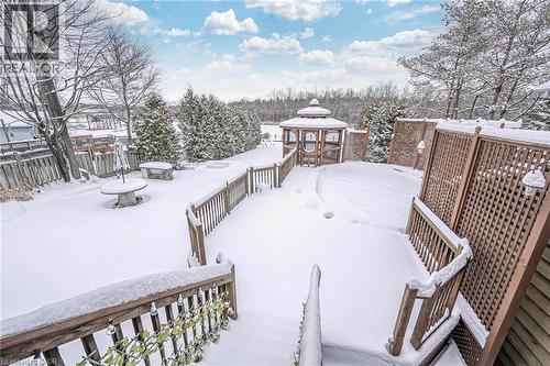 Spacious outdoor decking with wood railings and privacy screens overlooking a snow-covered yard with mature trees - 247 Sand Road, Holland Landing, ON - Outdoor With Deck Patio Veranda