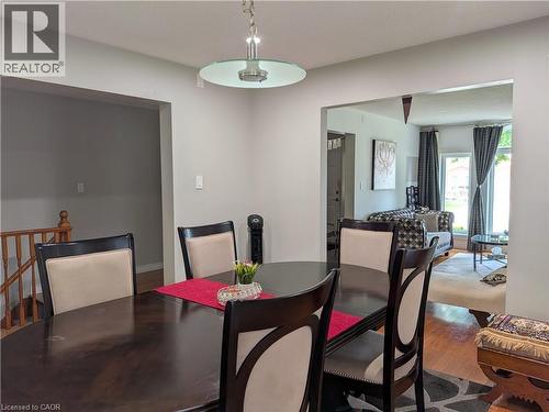 Recessed ceiling lighting, wood-finish flooring, and a staircase with wood railing - 45 Caswell Drive Unit# Upper, Hamilton, ON - Indoor Photo Showing Dining Room