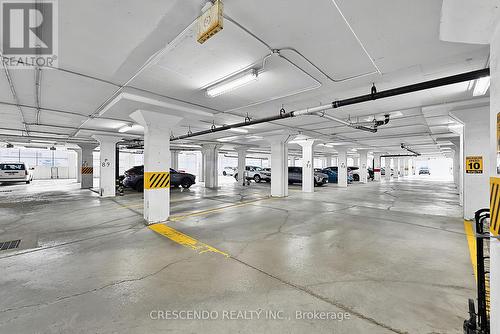 201 - 100 Millside Drive, Milton, ON - Indoor Photo Showing Garage