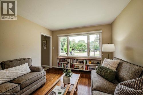 Living area featuring wood-finish flooring and neutral wall tones - 97 Somerset Crescent, Waterloo, ON - Indoor Photo Showing Living Room