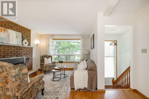 1928 Champlain Road, Tiny, ON - Indoor Photo Showing Living Room With Fireplace