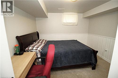 Carpeted flooring, recessed window, and white beadboard paneling - 35 Garden Crescent, Hamilton, ON - Indoor Photo Showing Bedroom
