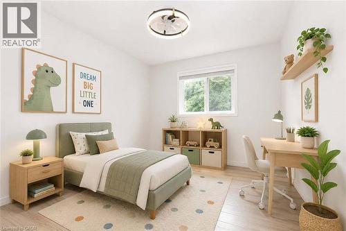 Bright room featuring a single window, overhead lighting, and light-toned wood-finish flooring - 47 Queensway Drive, Strathroy, ON - Indoor Photo Showing Bedroom