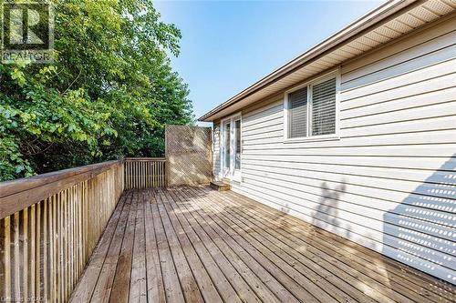 Spacious wood-finish deck with privacy lattice and railing - 47 Queensway Drive, Strathroy, ON - Outdoor With Deck Patio Veranda With Exterior