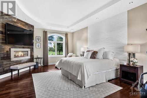 1409 Aberdeen Road, Champlain, ON - Indoor Photo Showing Bedroom With Fireplace