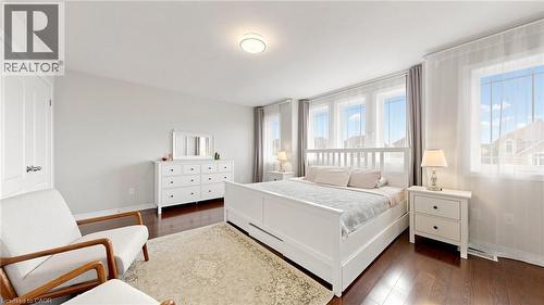 Recessed lighting, wood-finish flooring, multiple windows, and a built-in closet door - 173 Raymond Road, Ancaster, ON - Indoor Photo Showing Bedroom