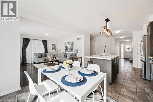 Open-concept living space with dark wood-finish flooring - 360 Freure Drive, Cambridge, ON - Indoor Photo Showing Dining Room