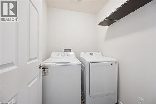 Dedicated laundry area with a built-in shelf - 360 Freure Drive, Cambridge, ON - Indoor Photo Showing Laundry Room