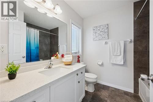 White vanity with an integrated sink, polished chrome faucet, and spacious countertop - 360 Freure Drive, Cambridge, ON - Indoor Photo Showing Bathroom