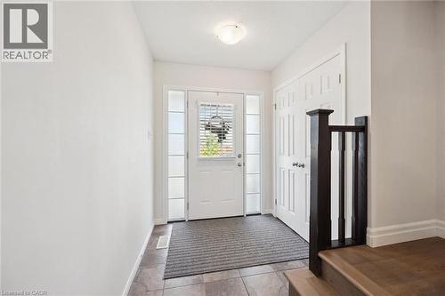 Entryway featuring a white door with integrated blinds, sidelight windows, and tile flooring - 360 Freure Drive, Cambridge, ON - Indoor Photo Showing Other Room