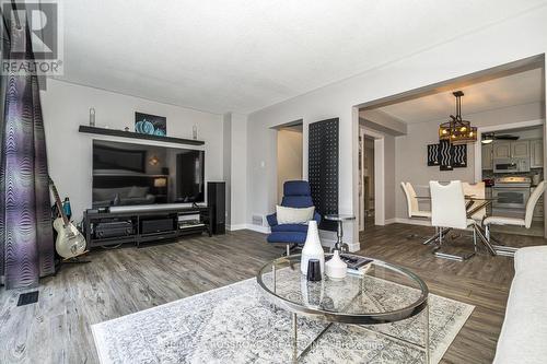 Fabulous Flowing Design-Slick Laminate Flooring - 655 Dodsworth Crescent, Mississauga, ON - Indoor Photo Showing Living Room