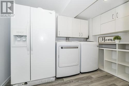 Modern Laundry Area with Storage - 655 Dodsworth Crescent, Mississauga, ON - Indoor Photo Showing Laundry Room
