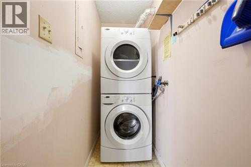 Stacked white washer and dryer units - 375 King Street N Unit# 708, Waterloo, ON - Indoor Photo Showing Laundry Room