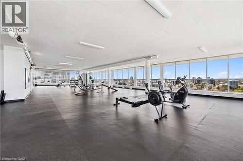 Fitness center with high ceilings, resilient flooring, and expansive windows - 375 King Street N Unit# 708, Waterloo, ON - Indoor Photo Showing Gym Room
