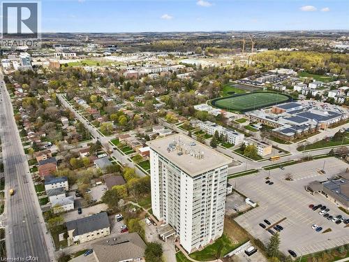 High-rise building with multiple balconies and a flat roof, surrounded by paved parking areas - 375 King Street N Unit# 708, Waterloo, ON - Outdoor With View