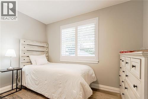 Window with white plantation shutters - 2105 Maplewood Drive, Burlington, ON - Indoor Photo Showing Bedroom