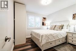 White walls with contrasting wood-finish flooring - 