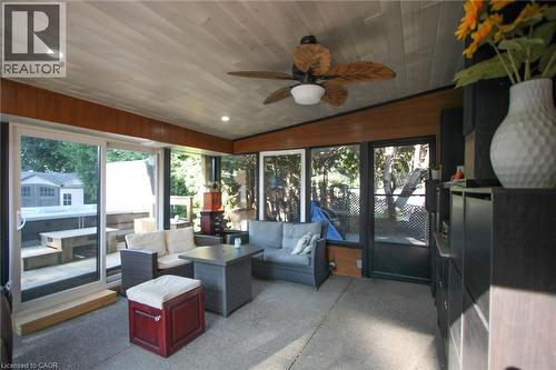 Enclosed sunroom featuring a wood-finish ceiling with recessed lighting and a ceiling fan - 2105 Maplewood Drive, Burlington, ON - Indoor