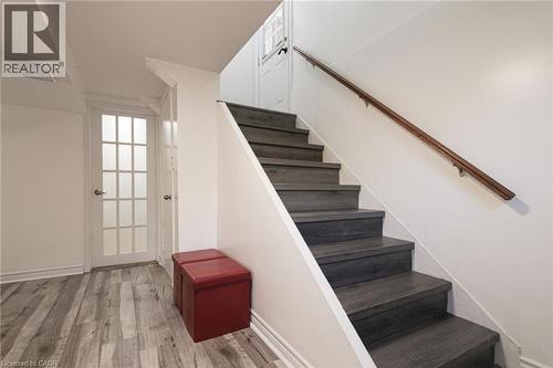 Wood-finish flooring with a light grey tone - 2105 Maplewood Drive, Burlington, ON - Indoor Photo Showing Other Room