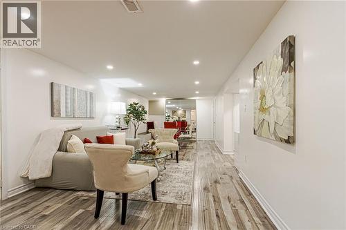 Recessed ceiling lighting, wood-finish flooring, white walls, and white trim - 2105 Maplewood Drive, Burlington, ON - Indoor